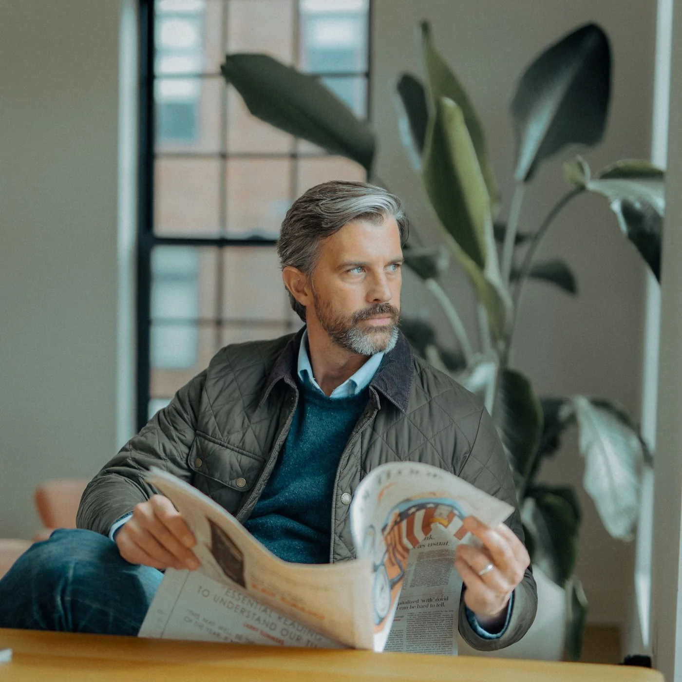 Middle-aged man relaxing at home in a casual jacket