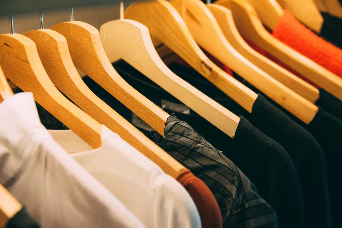 Clothes hanging on wooden hangers
